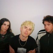 Waterparks infront of a white wall